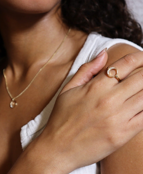 An elegant cushion-cut diamond ring on a display.